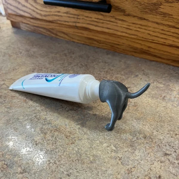 Kackender Welpe – Lustiger Zahnpastakappen‑Aufsatz